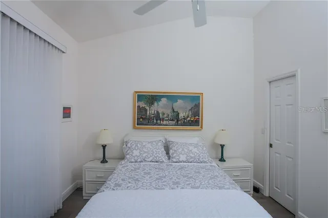 a large white bed in a white room