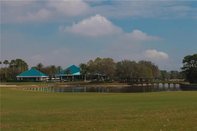 a view of a lake with houses in the background