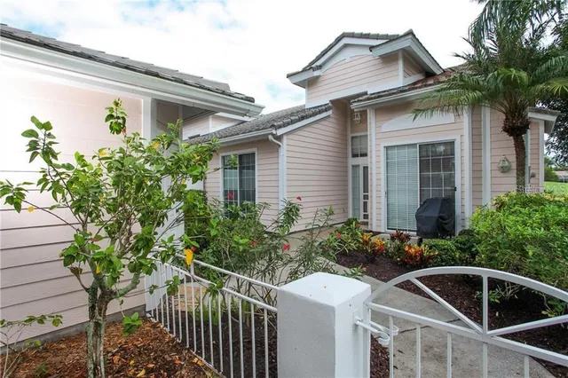 a front view of small house with yard