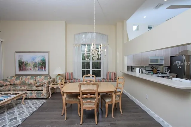 a dining room with wooden floor and breakfast area
