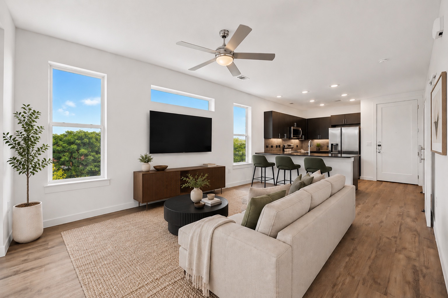 4801 Springdale Road, Unit 2301 Austin, TX 78723 - Photo 9 of 36 An open concept living area connects seamlessly with a contemporary kitchen, perfect for entertaining.
