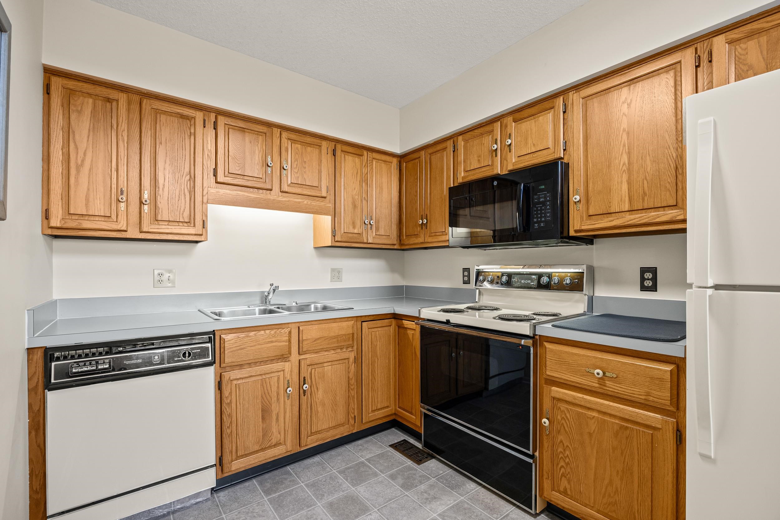 1093 Rosedale Drive Harrisonburg, VA 22801 - Photo 17 of 41 a kitchen with stainless steel appliances granite countertop a stove sink microwave and cabinets
