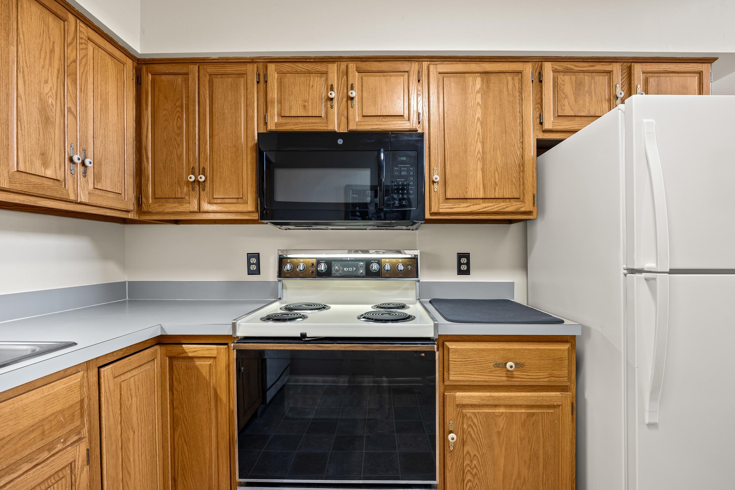 1093 Rosedale Drive Harrisonburg, VA 22801 - Photo 18 of 41 a kitchen with stainless steel appliances a stove a microwave and a refrigerator