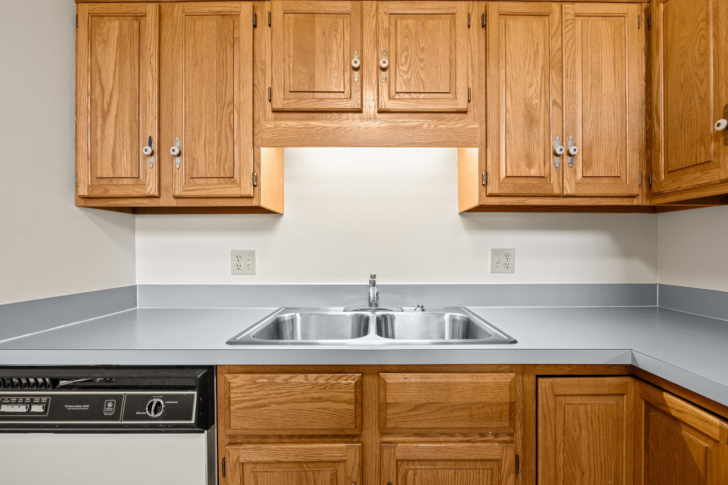 1093 Rosedale Drive Harrisonburg, VA 22801 - Photo 19 of 41 a kitchen with stainless steel appliances granite countertop white cabinets and a sink