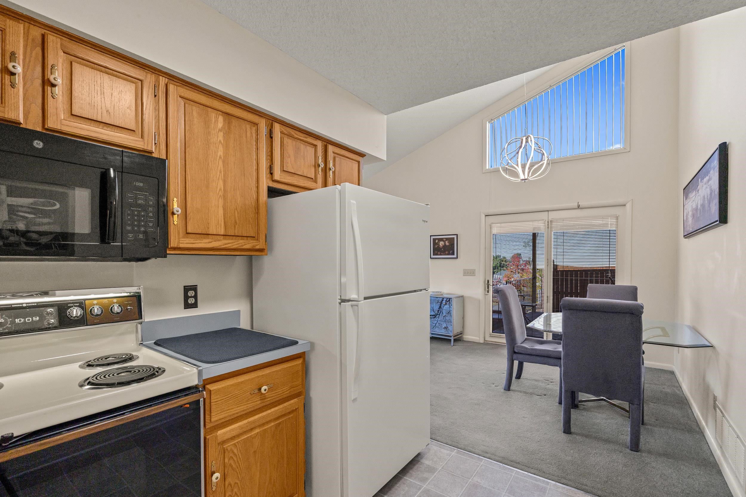 1093 Rosedale Drive Harrisonburg, VA 22801 - Photo 22 of 41 a kitchen with a refrigerator a stove top oven a sink and cabinets