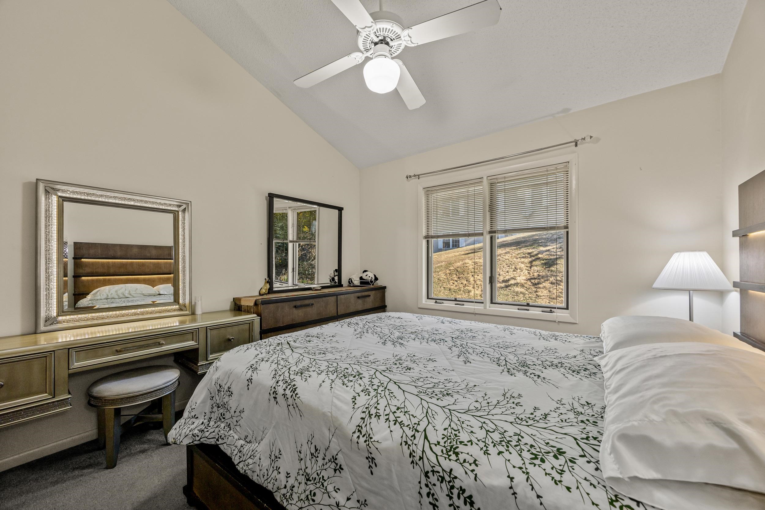 1093 Rosedale Drive Harrisonburg, VA 22801 - Photo 25 of 41 a bedroom with a bed and a chandelier