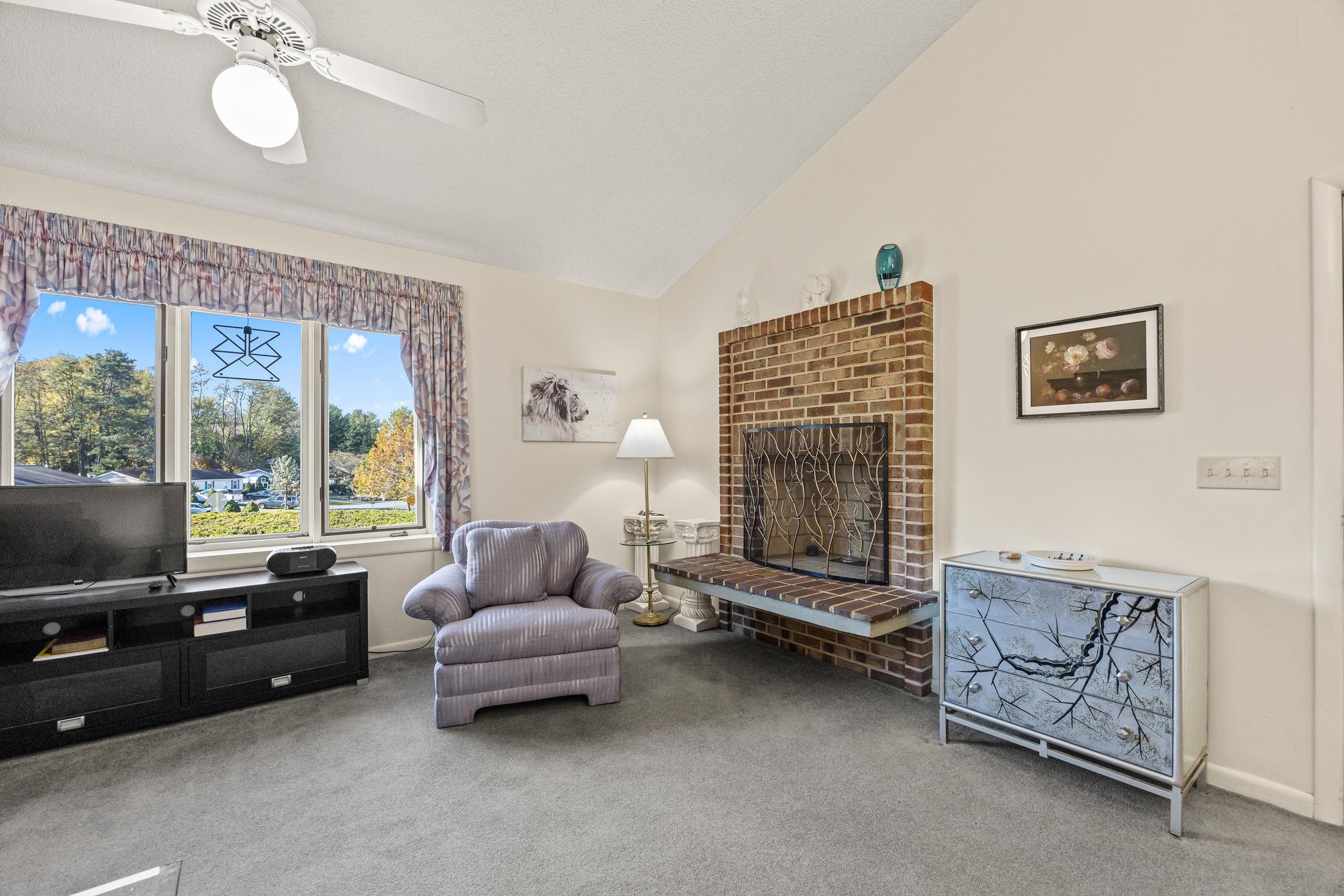 1093 Rosedale Drive Harrisonburg, VA 22801 - Photo 8 of 41 a living room with furniture and a flat screen tv