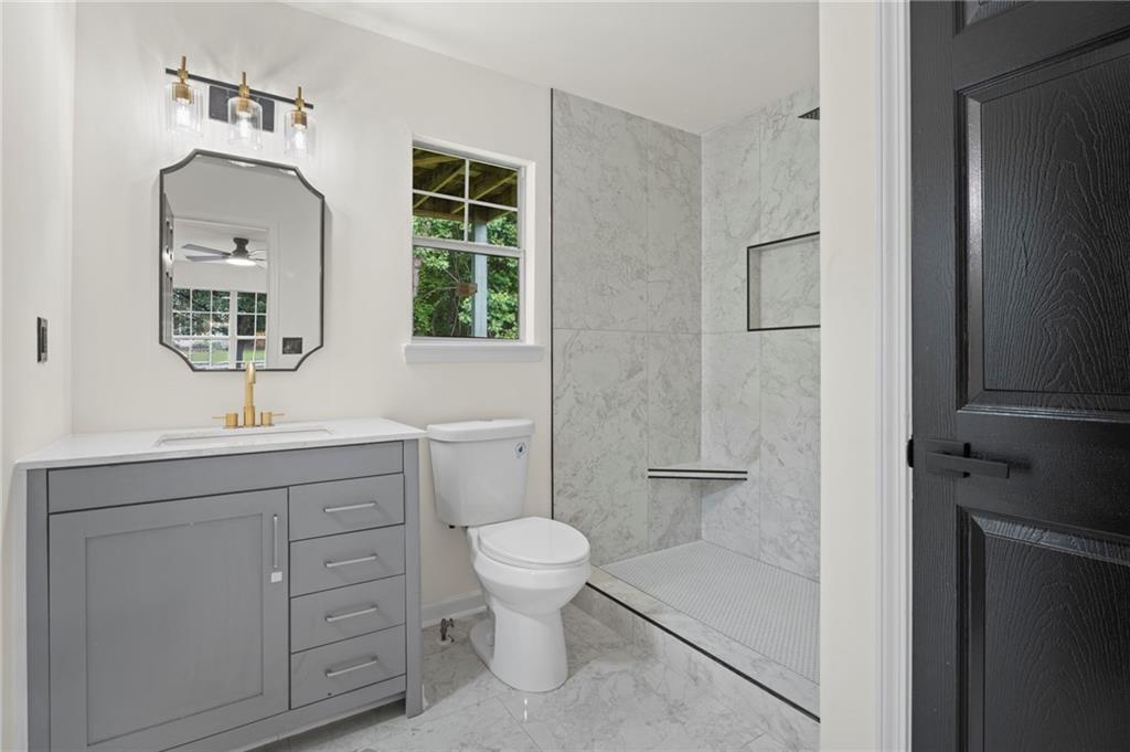3602 Bristol Overlook Rex, GA 30273 - Photo 29 of 37 a bathroom with a toilet sink and shower