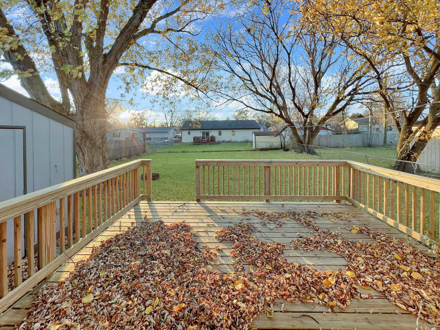 1815 Beach Road McHenry, IL 60050 - Photo 11 of 12 a view of a house with a large tree and a yard