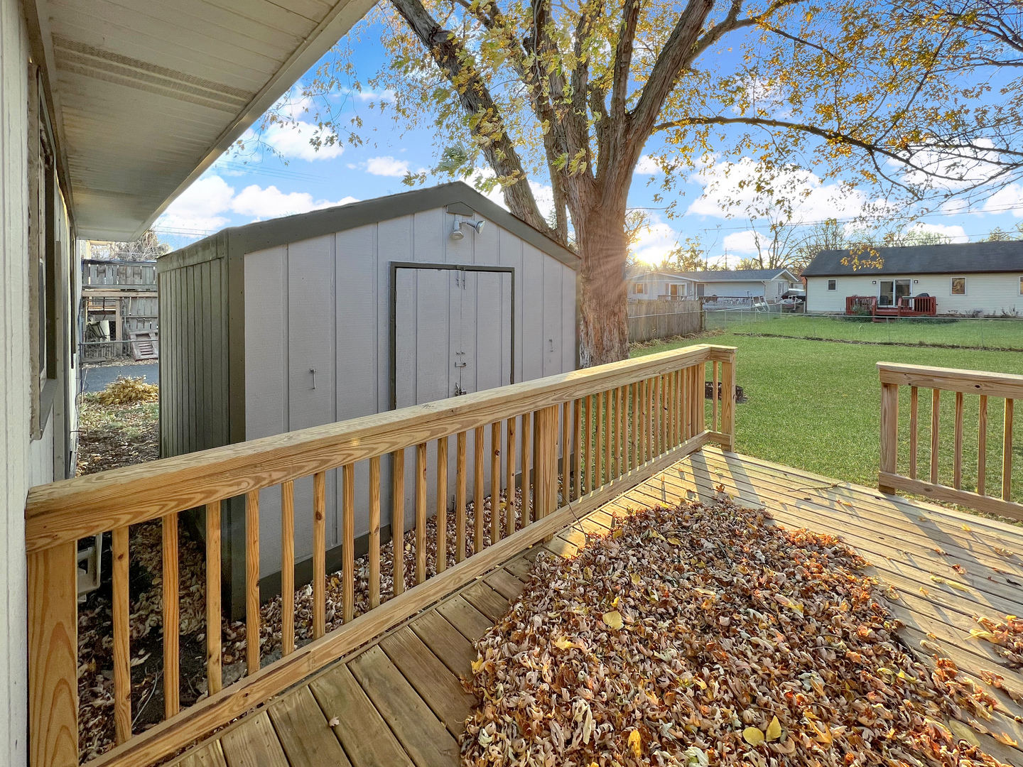 1815 Beach Road McHenry, IL 60050 - Photo 12 of 12 a view of a wooden deck with a yard