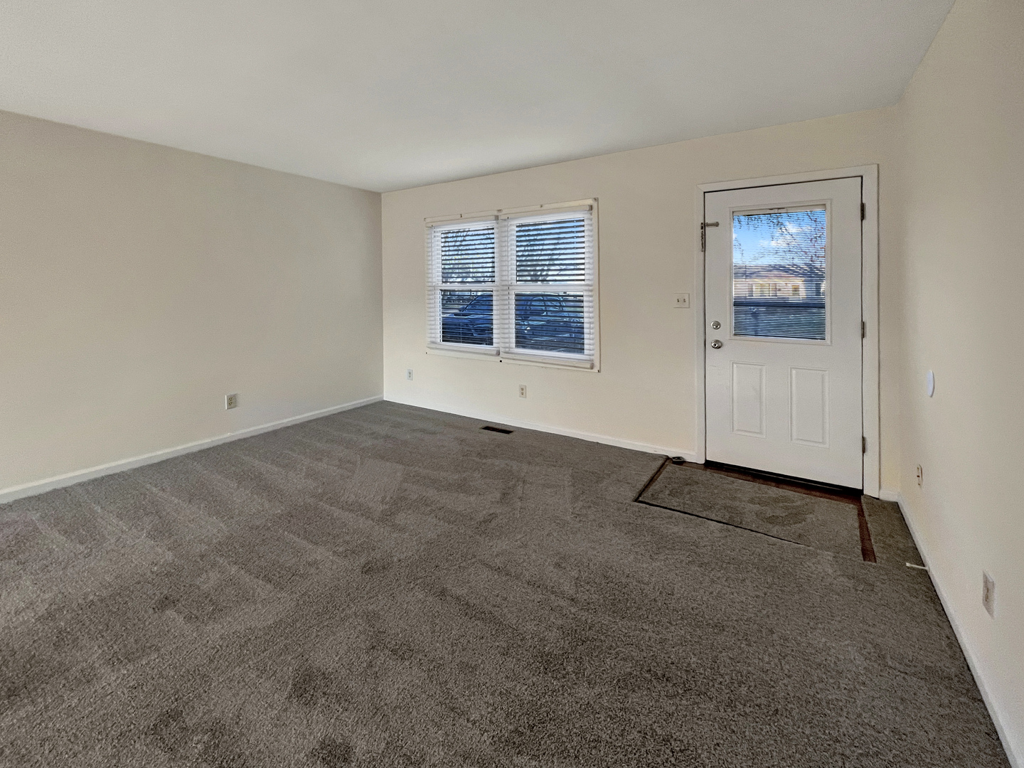 1815 Beach Road McHenry, IL 60050 - Photo 3 of 12 a view of an empty room with a window