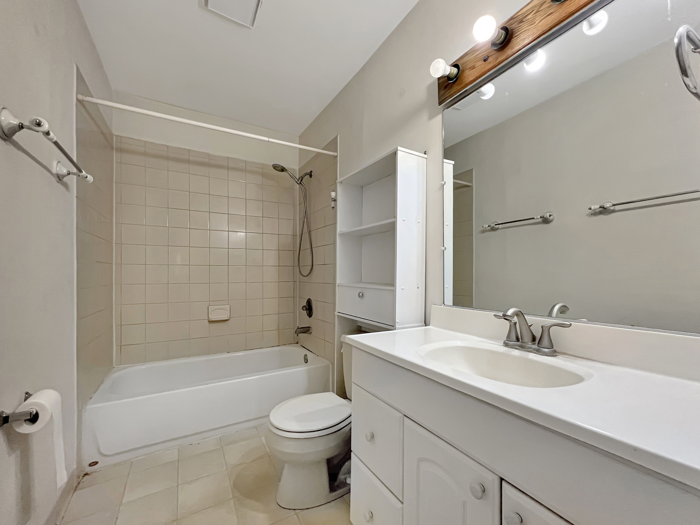 1815 Beach Road McHenry, IL 60050 - Photo 6 of 12 a bathroom with a sink a toilet and shower