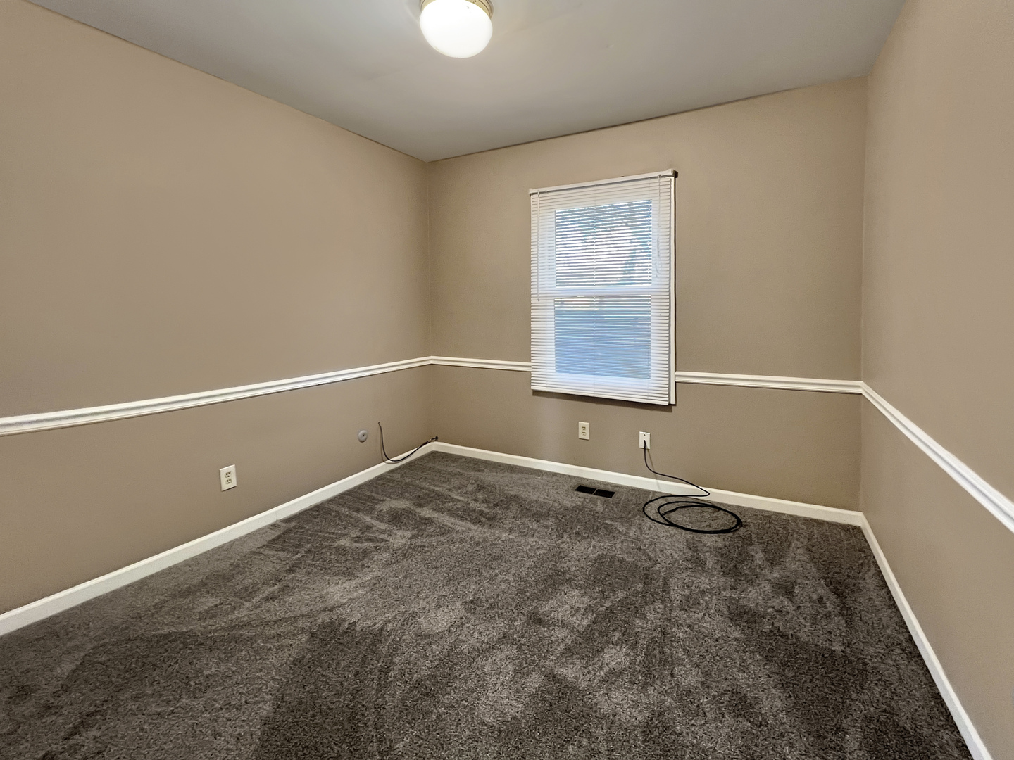 1815 Beach Road McHenry, IL 60050 - Photo 9 of 12 a view of an empty room with a window