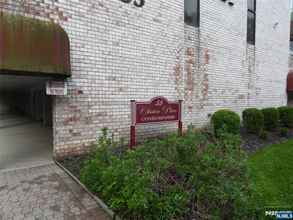 55 Clinton Place, Unit 301 Hackensack, NJ 07601 - Photo 2 of 17 a brick building with a yard