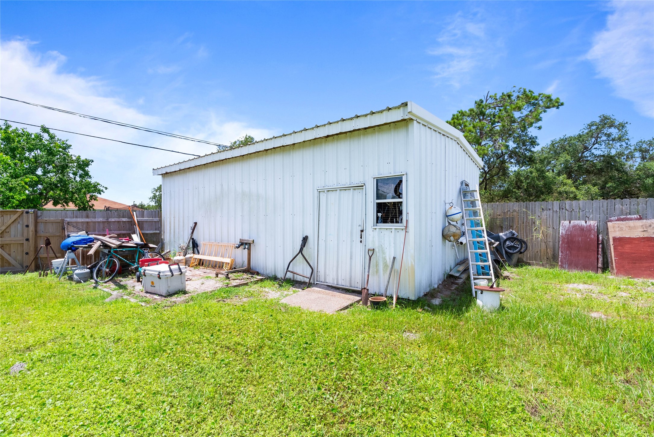 168 Sunset Ingleside, TX 78362 - Photo 24 of 26 Exterior view of the detached garage/workshop structure located in the backyard.