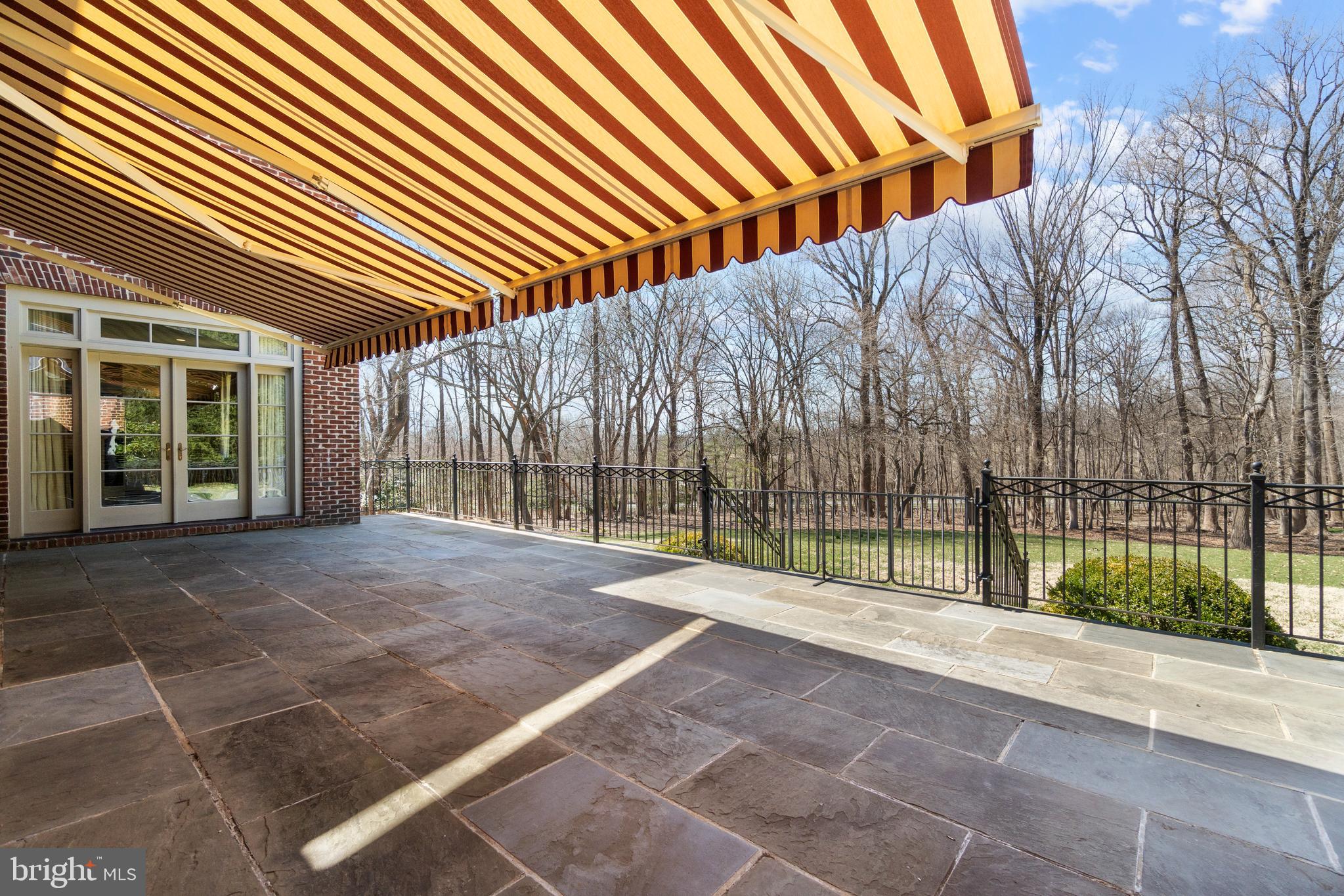 8402 Rapley Ridge Lane Potomac, MD 20854 - Photo 29 of 64 Slate Terrace with Automatic Retractable Awning