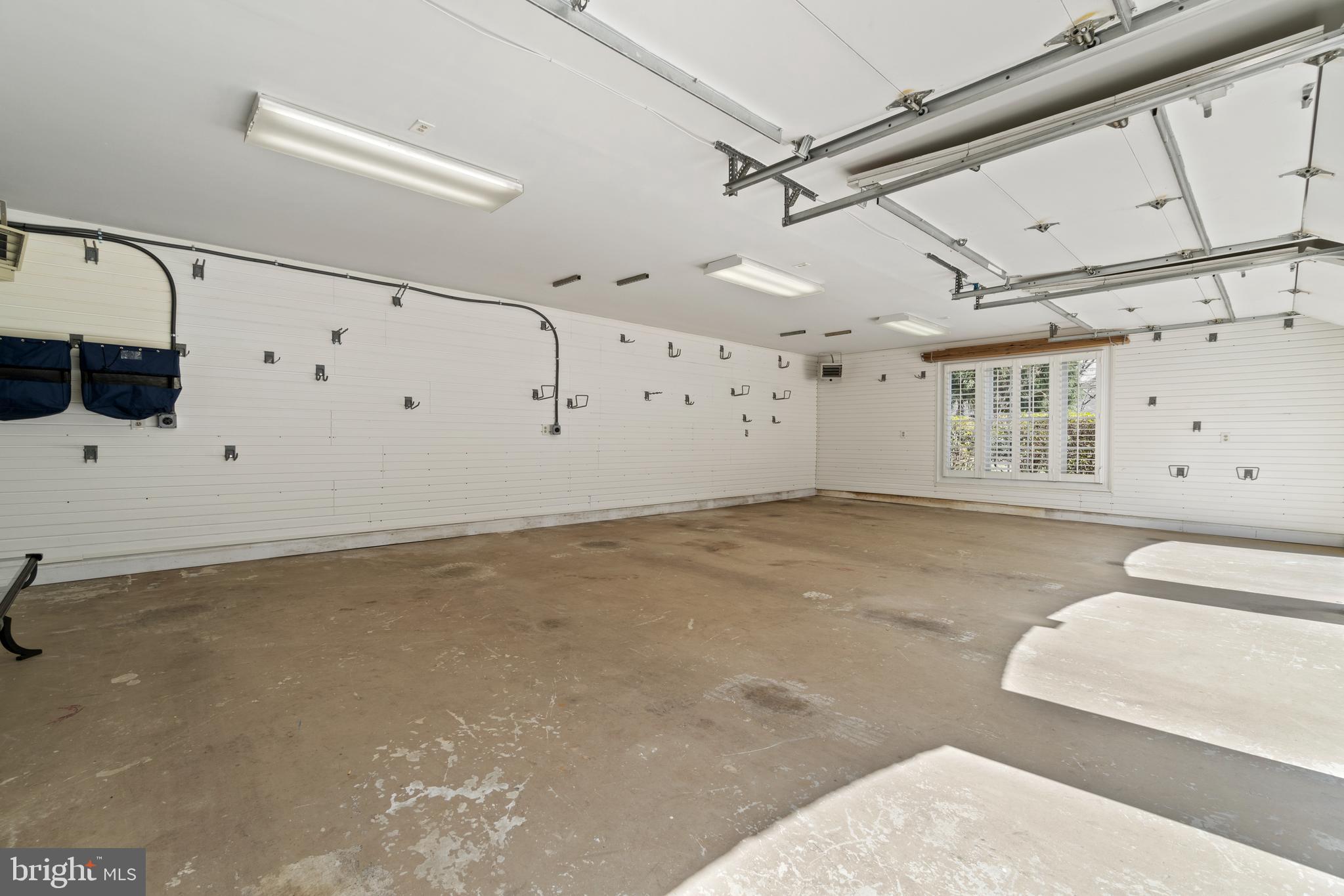 8402 Rapley Ridge Lane Potomac, MD 20854 - Photo 60 of 64 3 Car Garage Equipped with 2 EV Charging Station