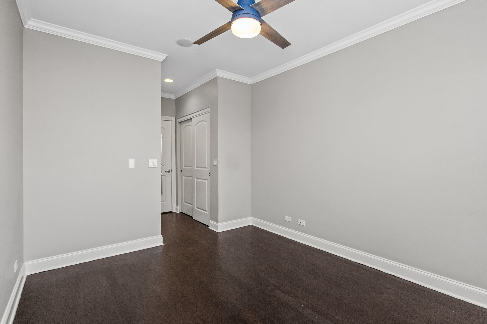 4444 North Damen Avenue, Unit 4E Chicago, IL 60625 - Photo 12 of 25 an empty room with wooden floor and a ceiling fan