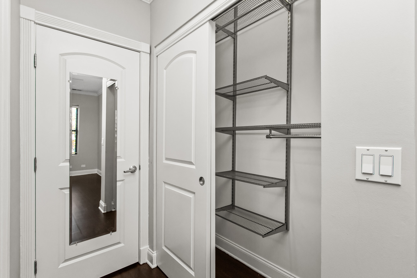 4444 North Damen Avenue, Unit 4E Chicago, IL 60625 - Photo 13 of 25 a room with a walk in closet and wooden floor