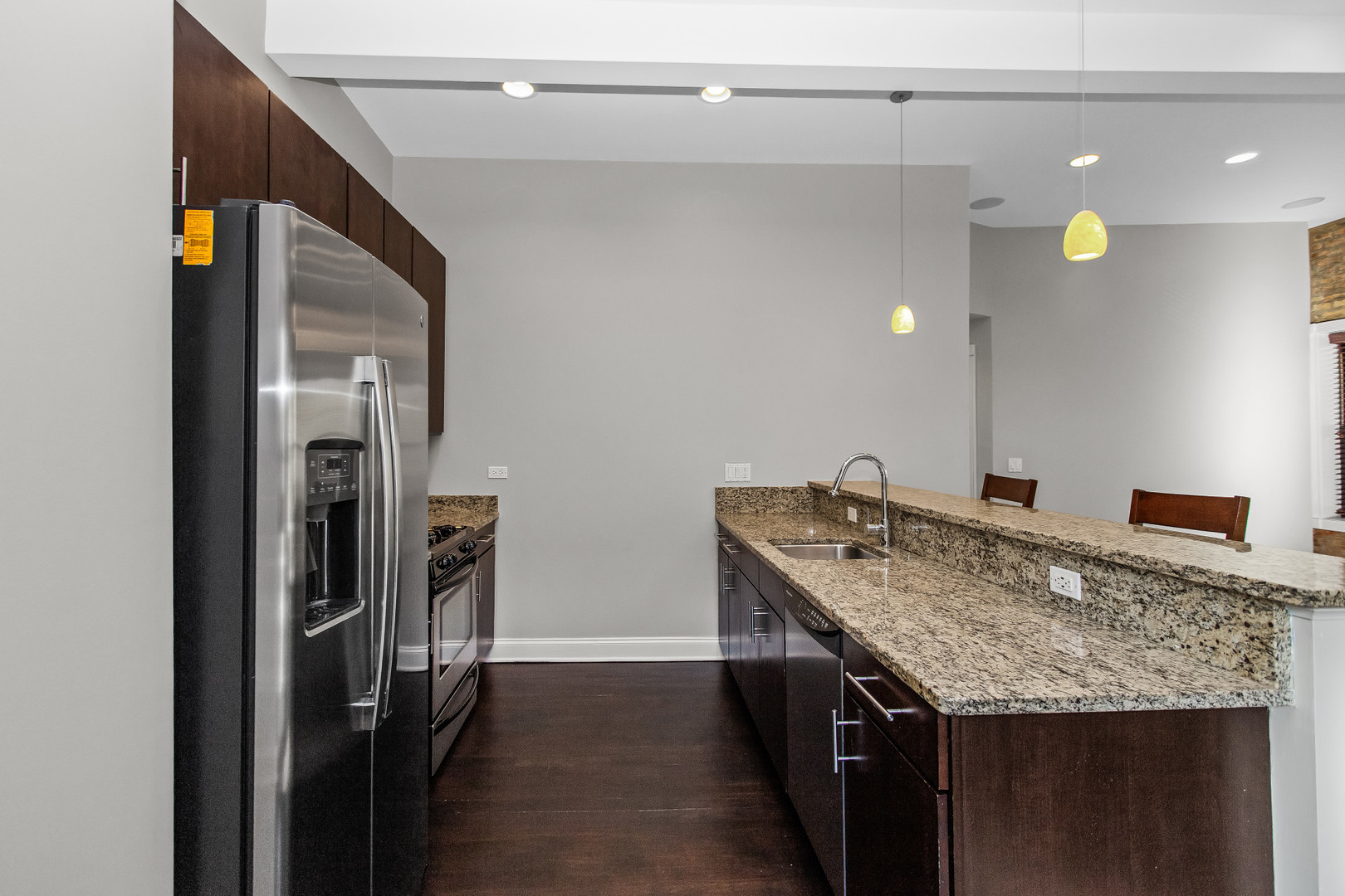 4444 North Damen Avenue, Unit 4E Chicago, IL 60625 - Photo 10 of 25 a bathroom with a granite countertop sink and a mirror