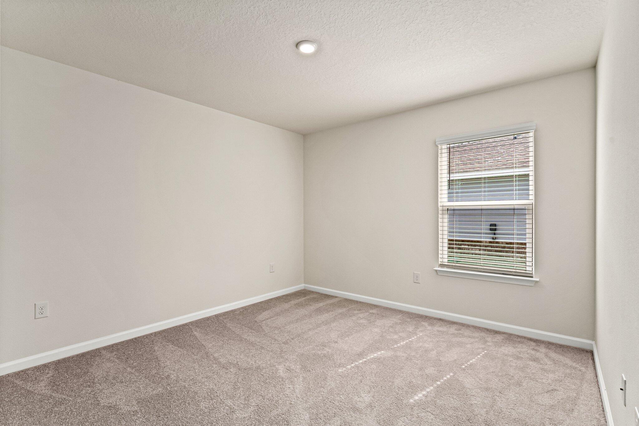 794 Riverwalk Circle Freeport, FL 32439 - Photo 14 of 31 an empty room with a window