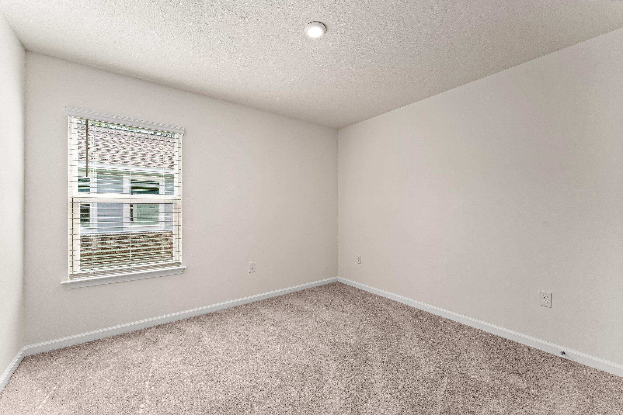 794 Riverwalk Circle Freeport, FL 32439 - Photo 16 of 31 a view of an empty room with a window