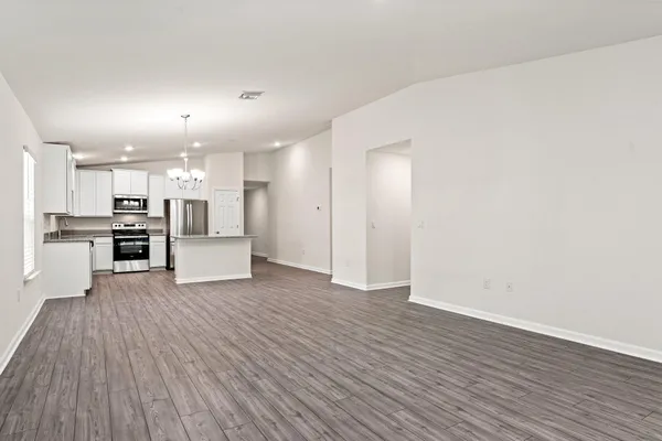 a view of kitchen with wooden floor