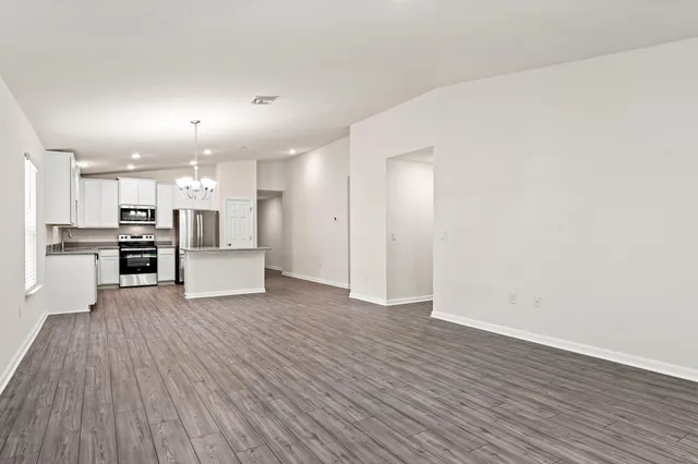 a view of kitchen with wooden floor