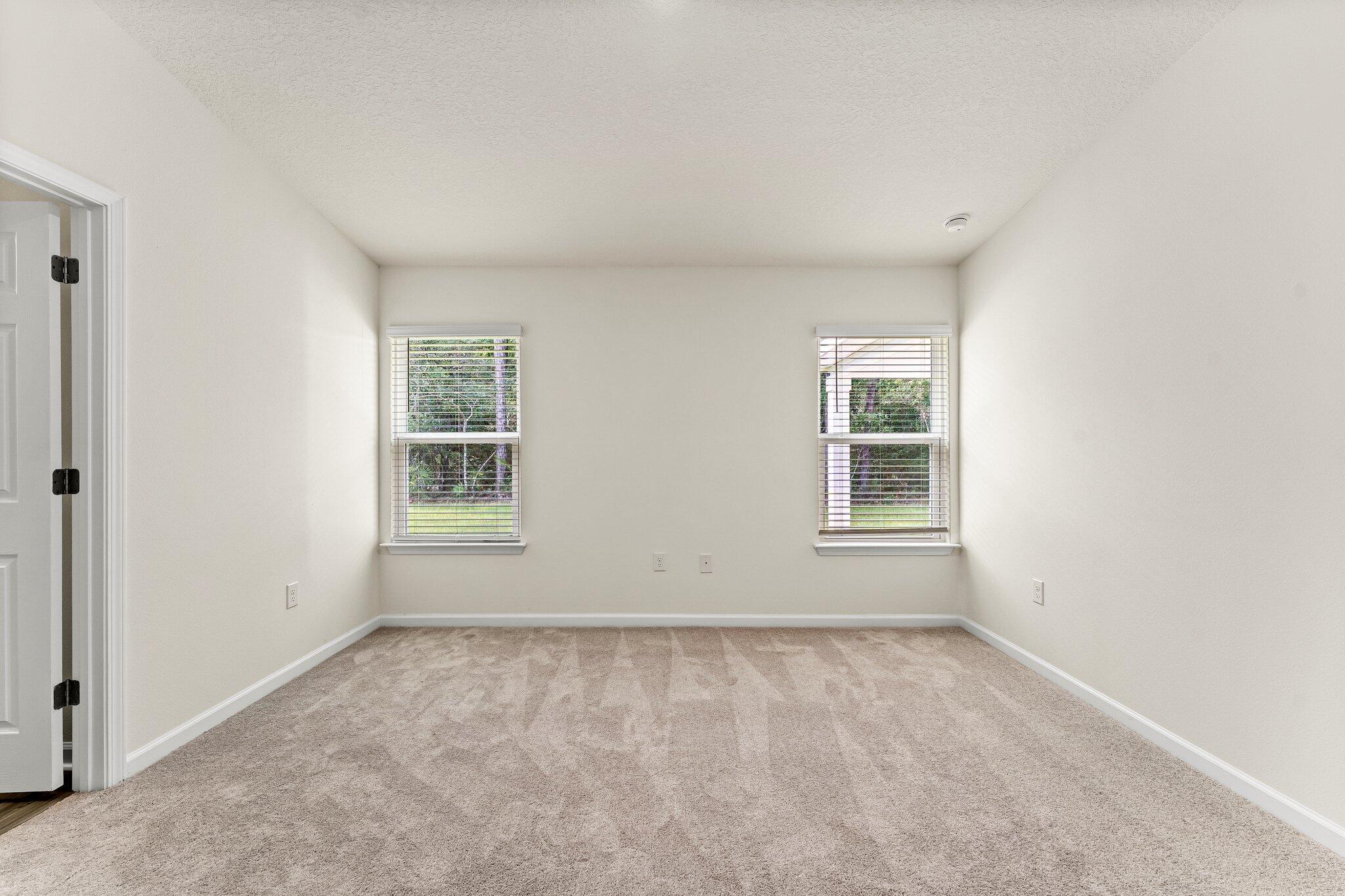 794 Riverwalk Circle Freeport, FL 32439 - Photo 24 of 31 an empty room with windows