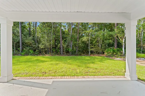 a view of a yard with an outdoor seating