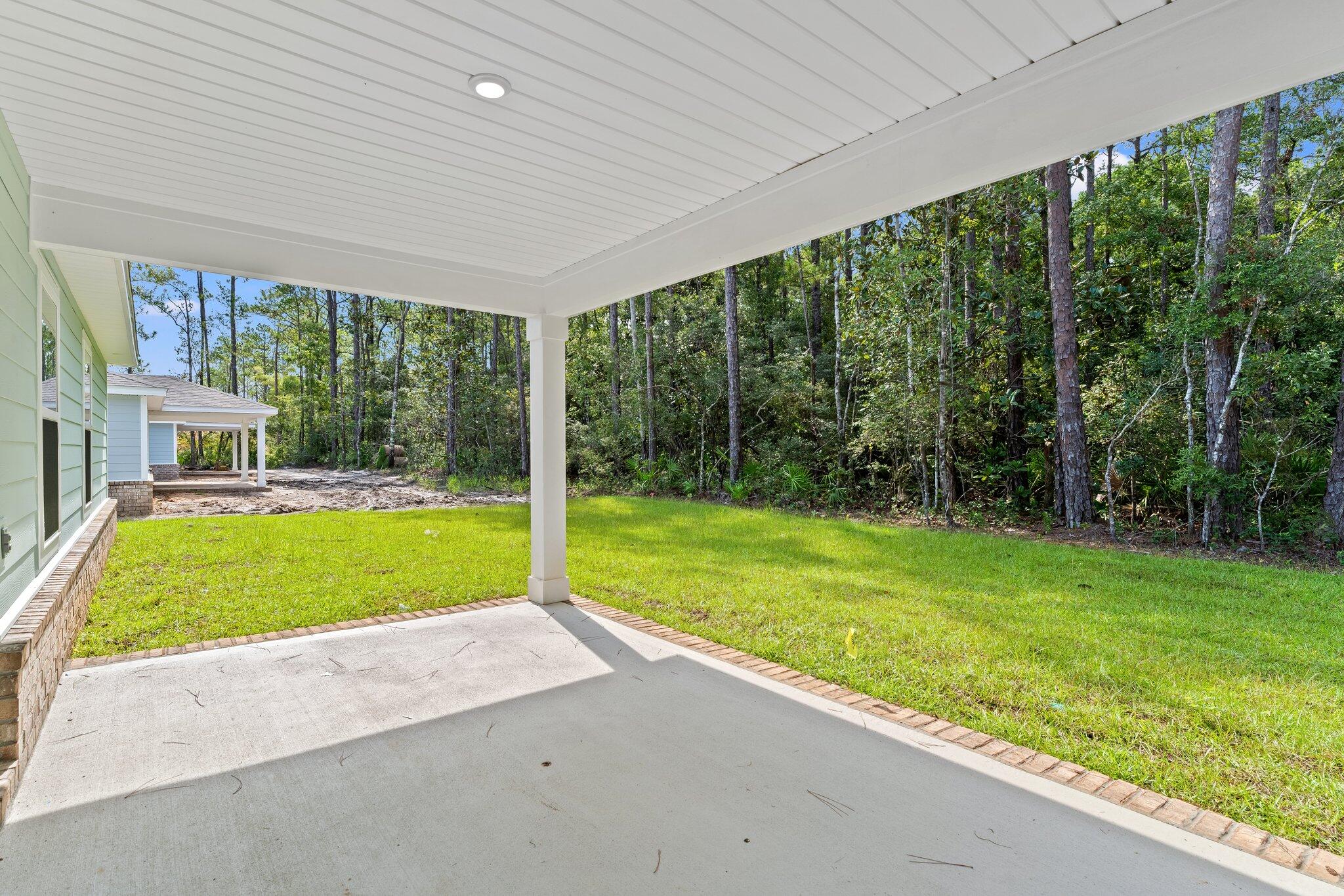 794 Riverwalk Circle Freeport, FL 32439 - Photo 29 of 31 a view of backyard with large trees