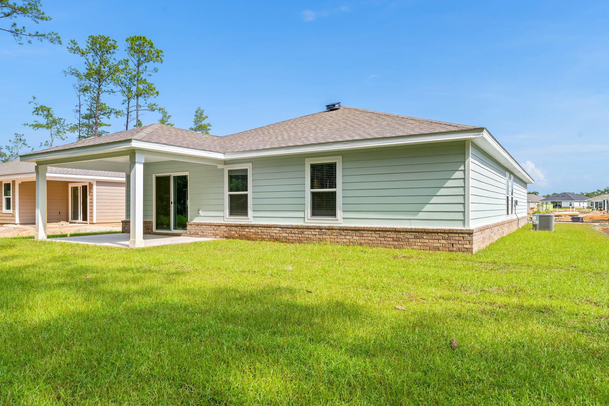 794 Riverwalk Circle Freeport, FL 32439 - Photo 31 of 31 a view of a house with a backyard