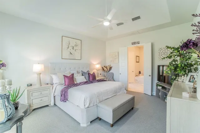 a bedroom with a bed and a couch