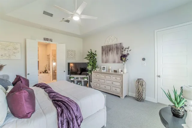 a bedroom with a bed and furniture