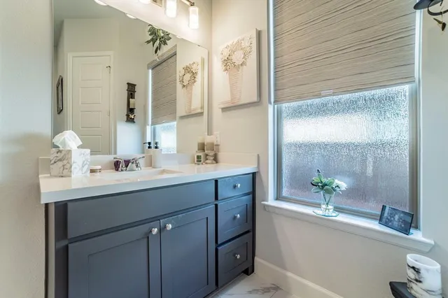 a bathroom with a sink double vanity and a mirror