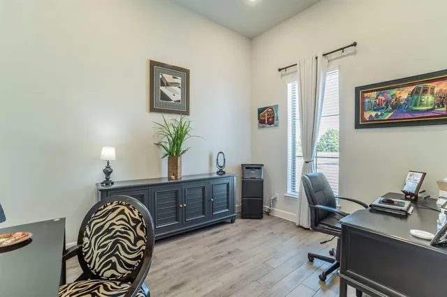 a bedroom with furniture and a chandelier