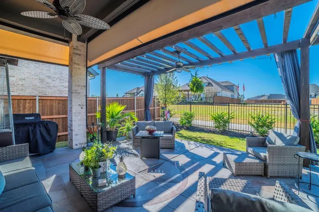 a dining room filled with furniture and a potted plant