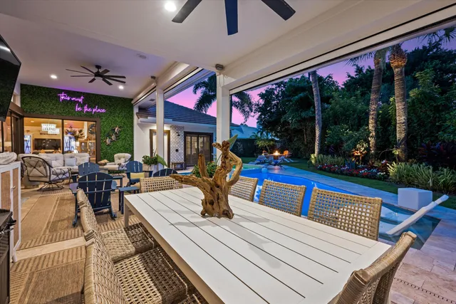a outdoor space with a large window and couches