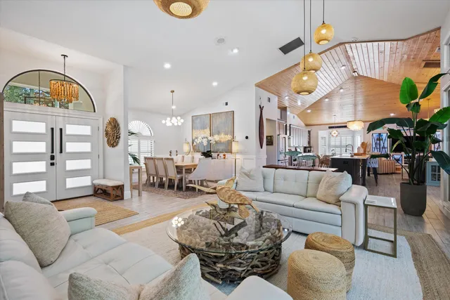 a living room with furniture a fireplace and white walls
