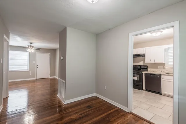 a view of a kitchen cabinets and wooden floor