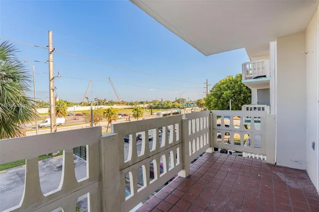 a view of balcony with furniture