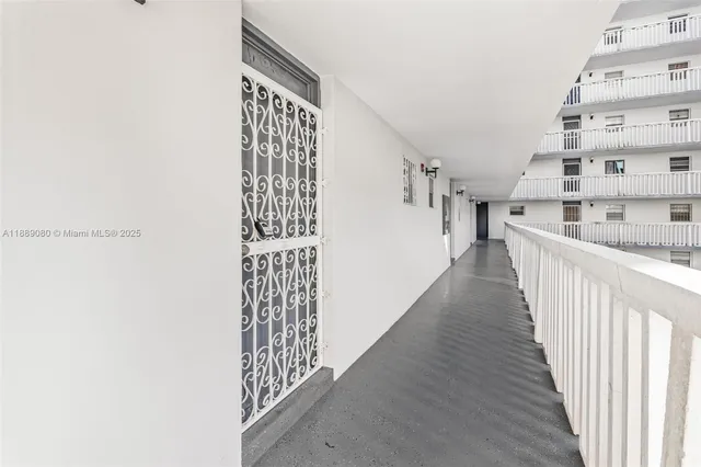 a view of a hallway with windows