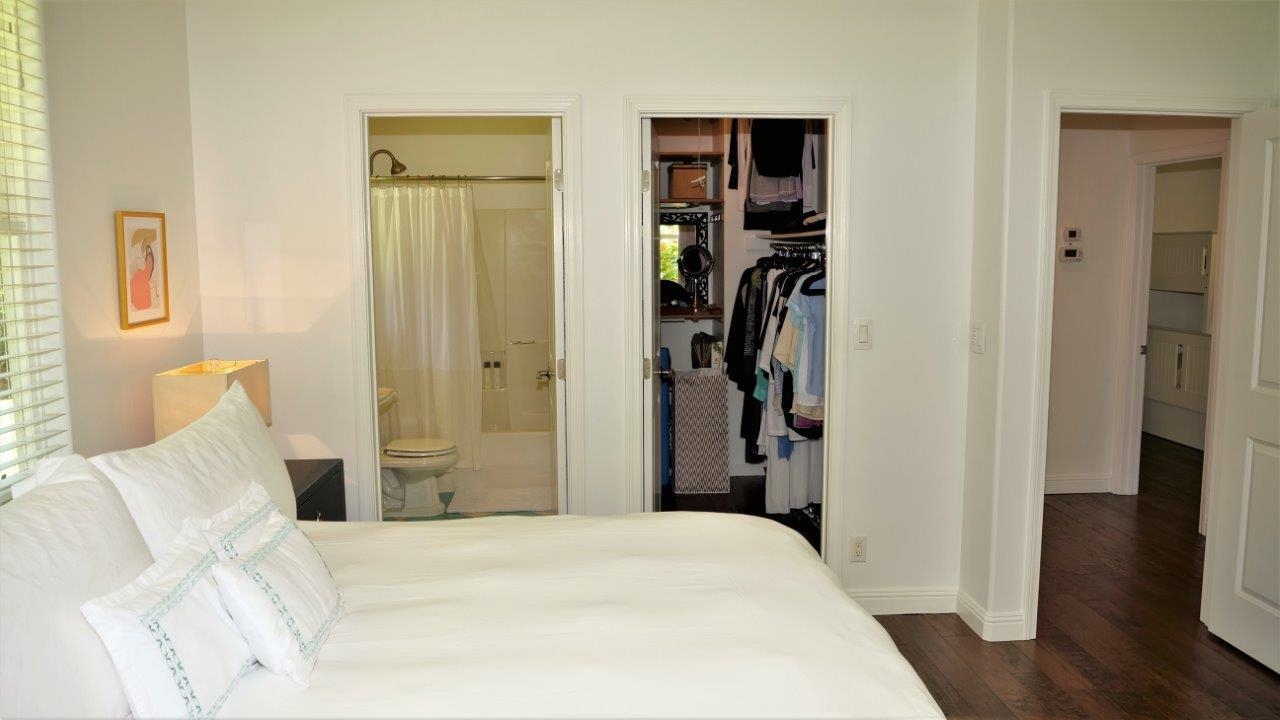 47 Hale Lio Place Haiku, HI 96708 - Photo 11 of 25 a bedroom with a bed and a wooden floor