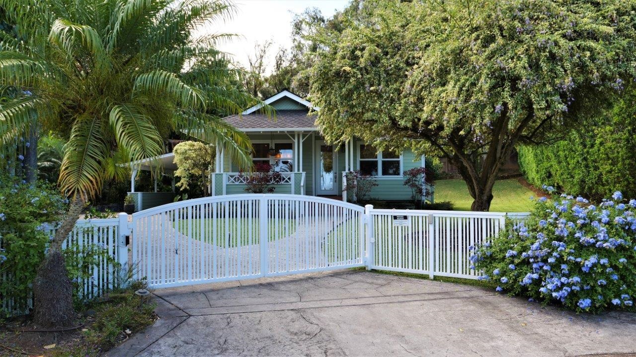 47 Hale Lio Place Haiku, HI 96708 - Photo 2 of 25 a view of a wooden house with a small yard and plants