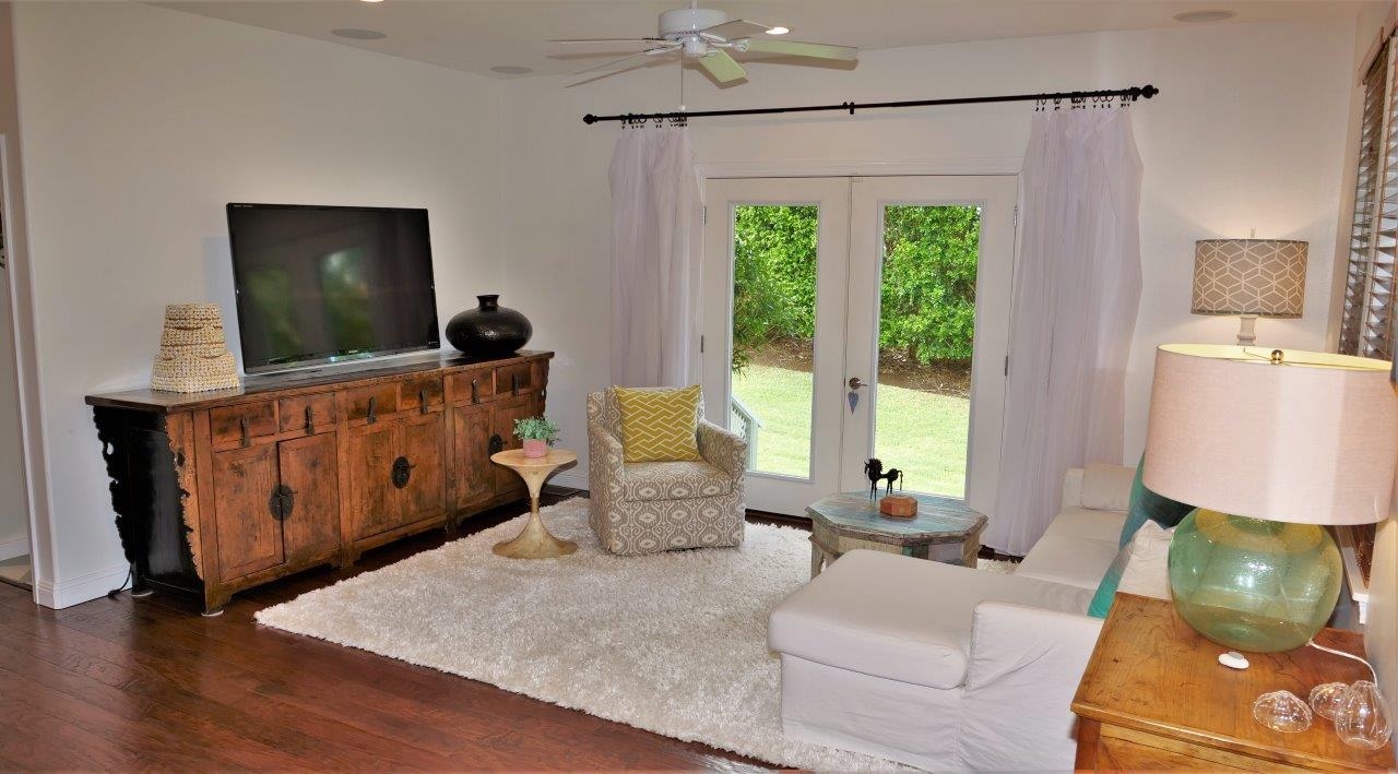 47 Hale Lio Place Haiku, HI 96708 - Photo 4 of 25 a living room with furniture and a flat screen tv