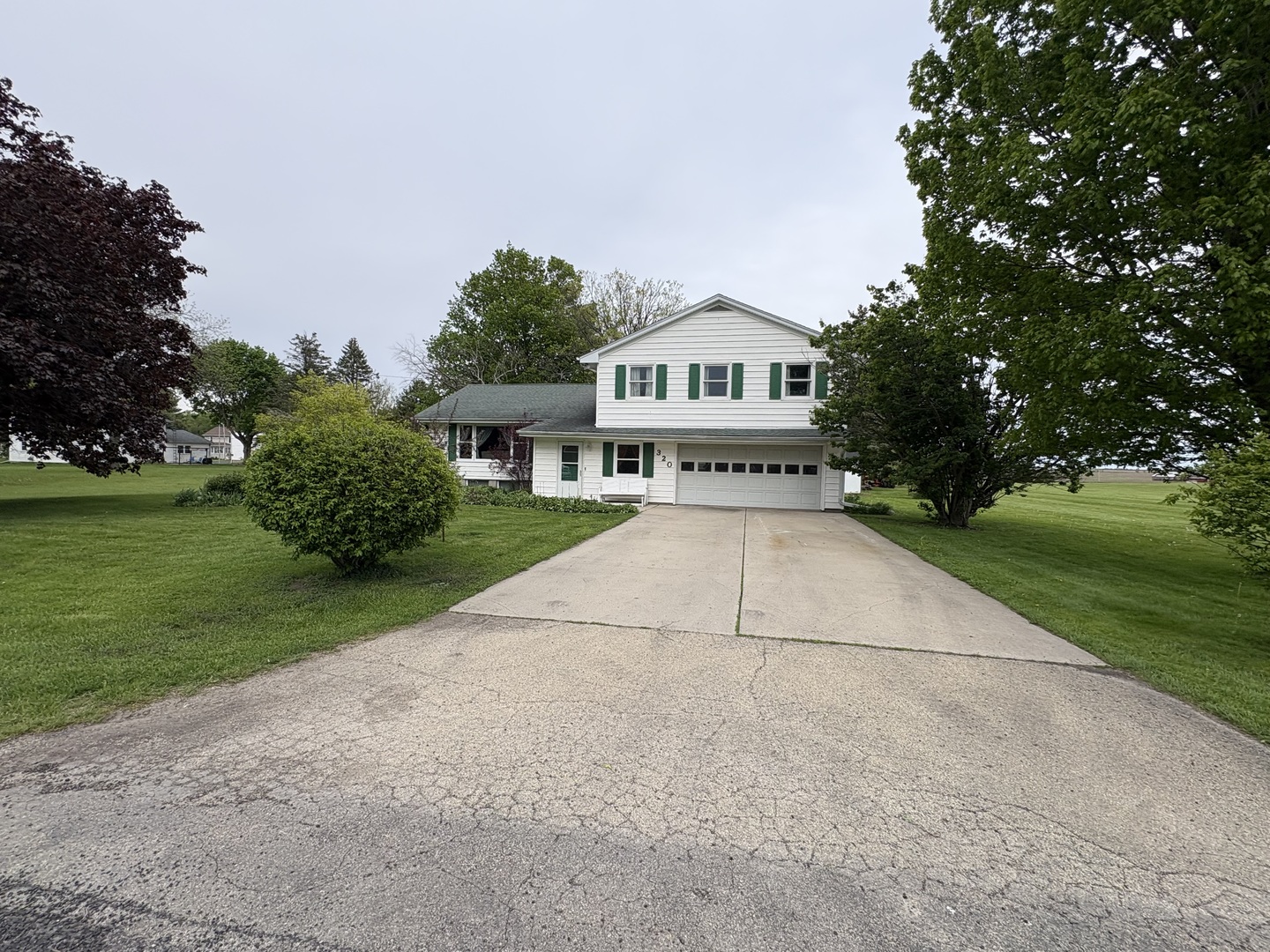 320 South Main Street Creston, IL 61068 - Photo 1 of 34 a view of a house with a yard