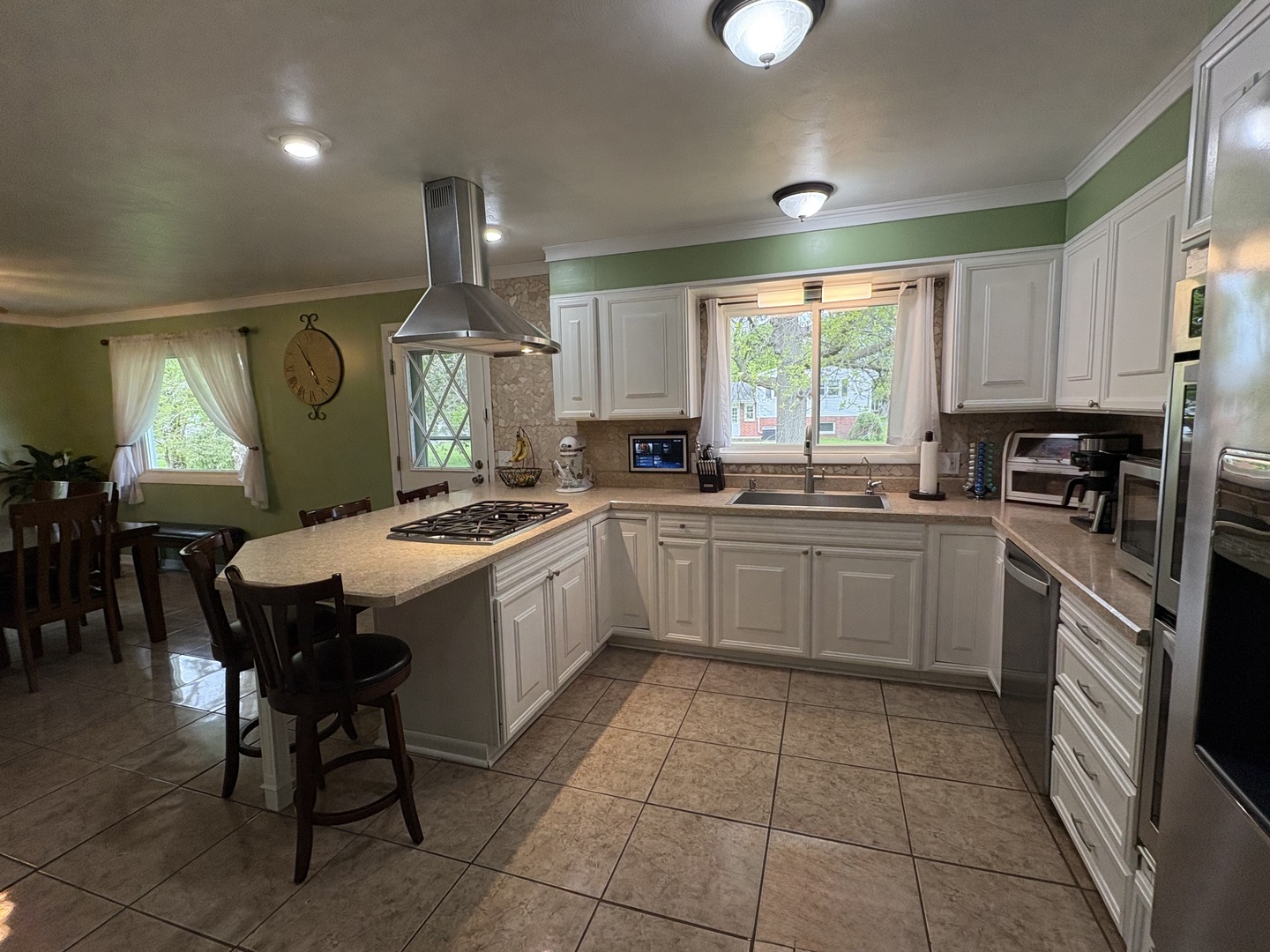 320 South Main Street Creston, IL 61068 - Photo 13 of 34 a kitchen with a sink window and cabinets