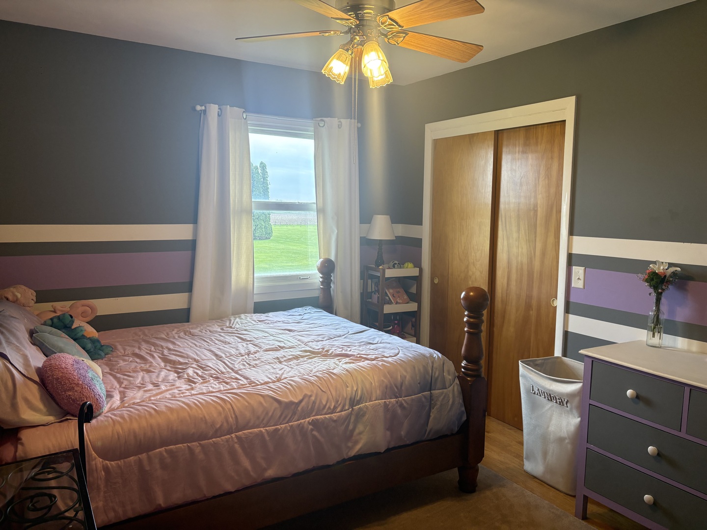 320 South Main Street Creston, IL 61068 - Photo 18 of 34 a bedroom with a bed and a chandelier