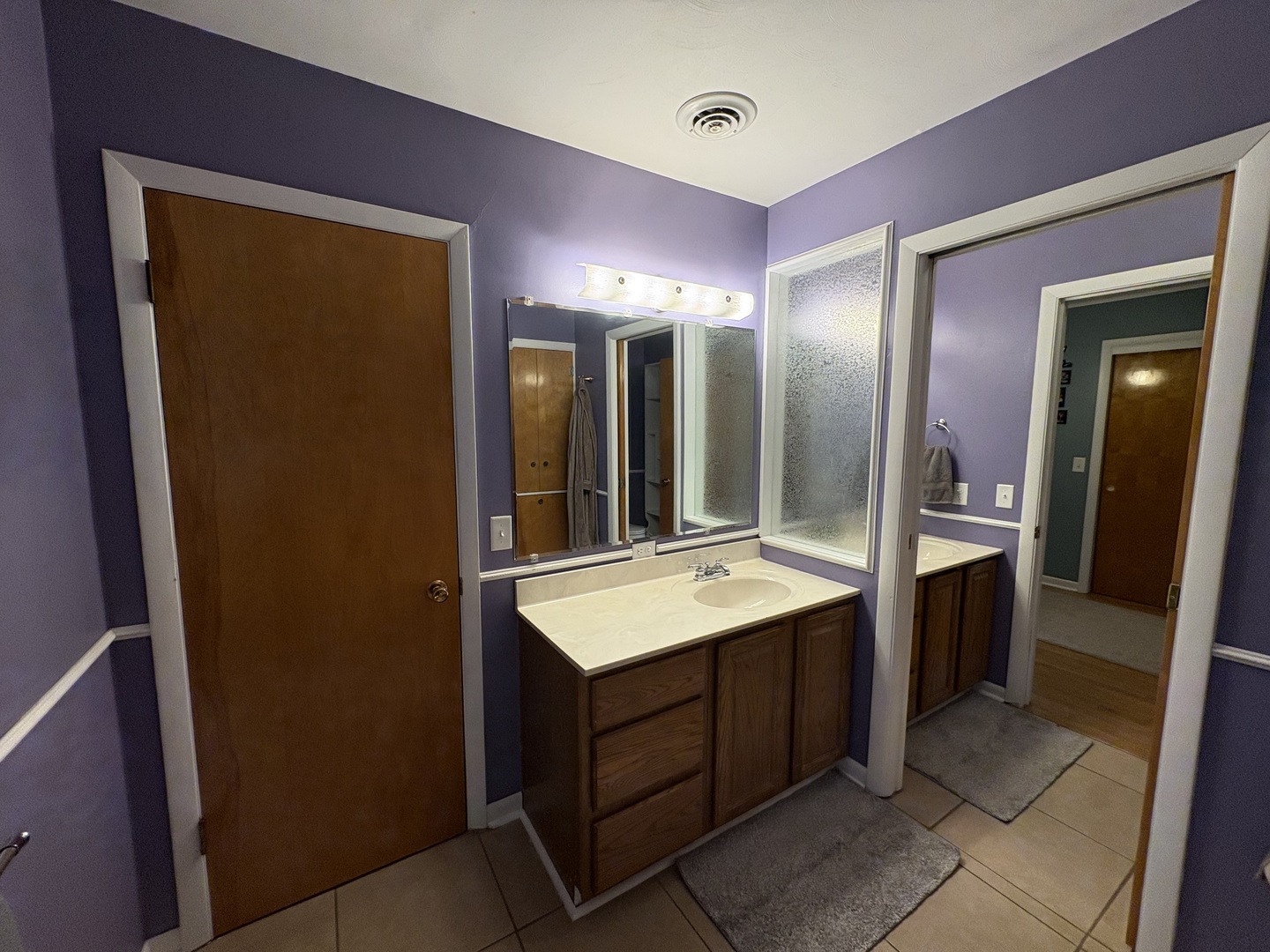 320 South Main Street Creston, IL 61068 - Photo 20 of 34 a bathroom with a sink vanity granite tub and a mirror