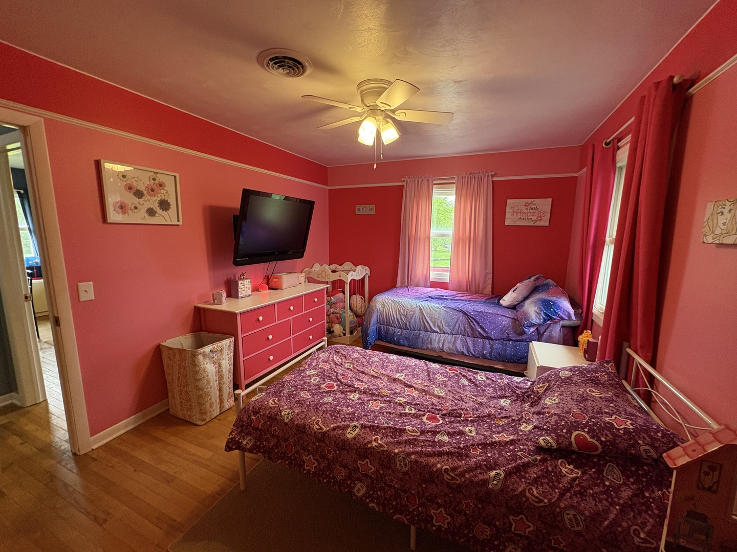 320 South Main Street Creston, IL 61068 - Photo 22 of 34 a bedroom with bed and a flat screen tv